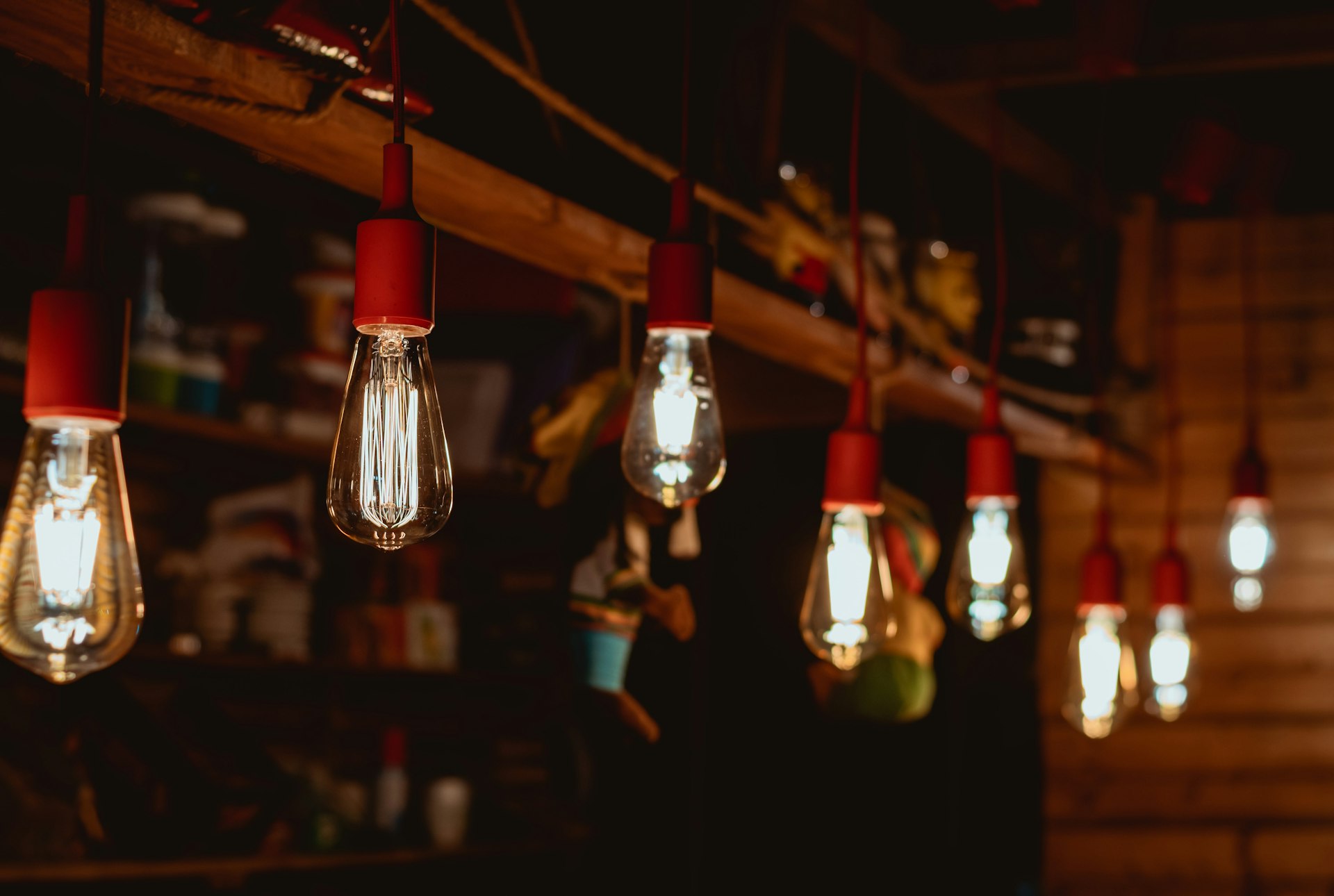 selective focus photography of red and yellow light bulb